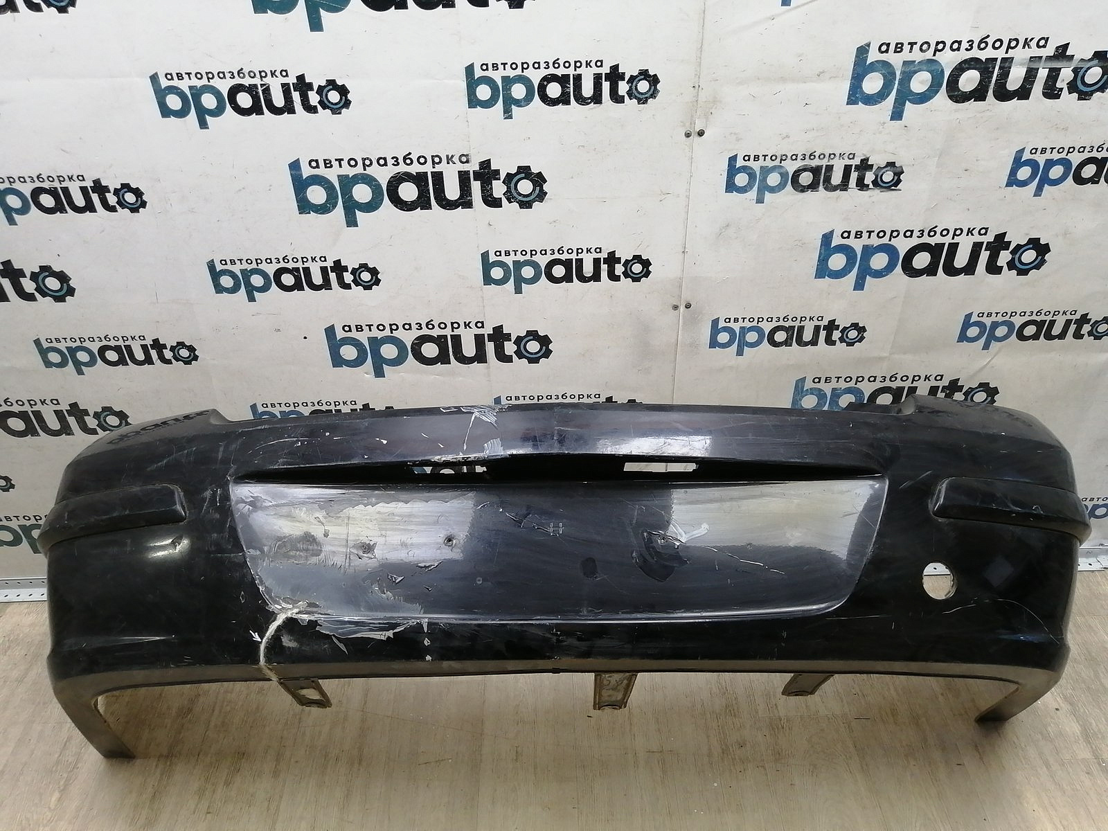 Пример детали Бампер задний; без паркт. (94703454); Opel Astra H Sedan (2005 — 2008), H рест. Sedan (2008 — 2015) /AA044740/ БУ; Оригинал; Р2, Удовлетворительное; 