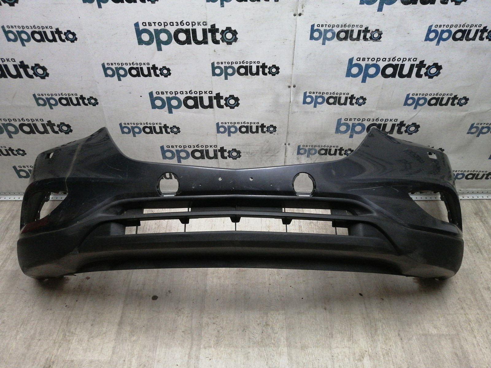 Фотография детали AA045584; Бампер передний; без паркт.; под омыват. (TK21-50031) для Mazda CX-9 I рест. (2012-2016)/БУ; Оригинал; Р1, Мелкий дефект; . Фото номер 1