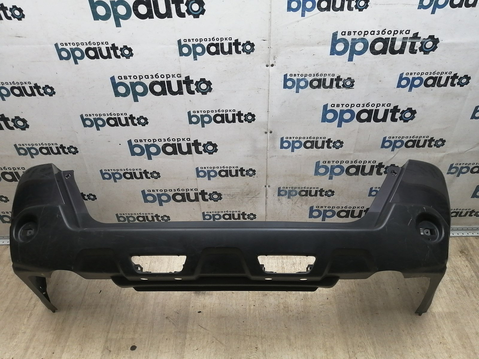 Пример детали Бампер задний; без паркт. (85022-JU14H); Nissan X-Trail II (T31) (2007-2011), II (T31) рест. (2011-2015) /BA000199/ БУ; Оригинал; Р1, Мелкий дефект; 