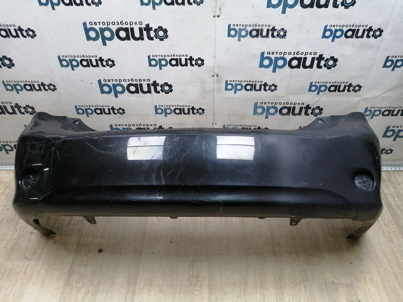 Пример детали Бампер задний; без паркт. (52159-12A30); Toyota Corolla 150 (2006-2009) /AA045247/ БУ; Оригинал; Р2, Удовлетворительное; 