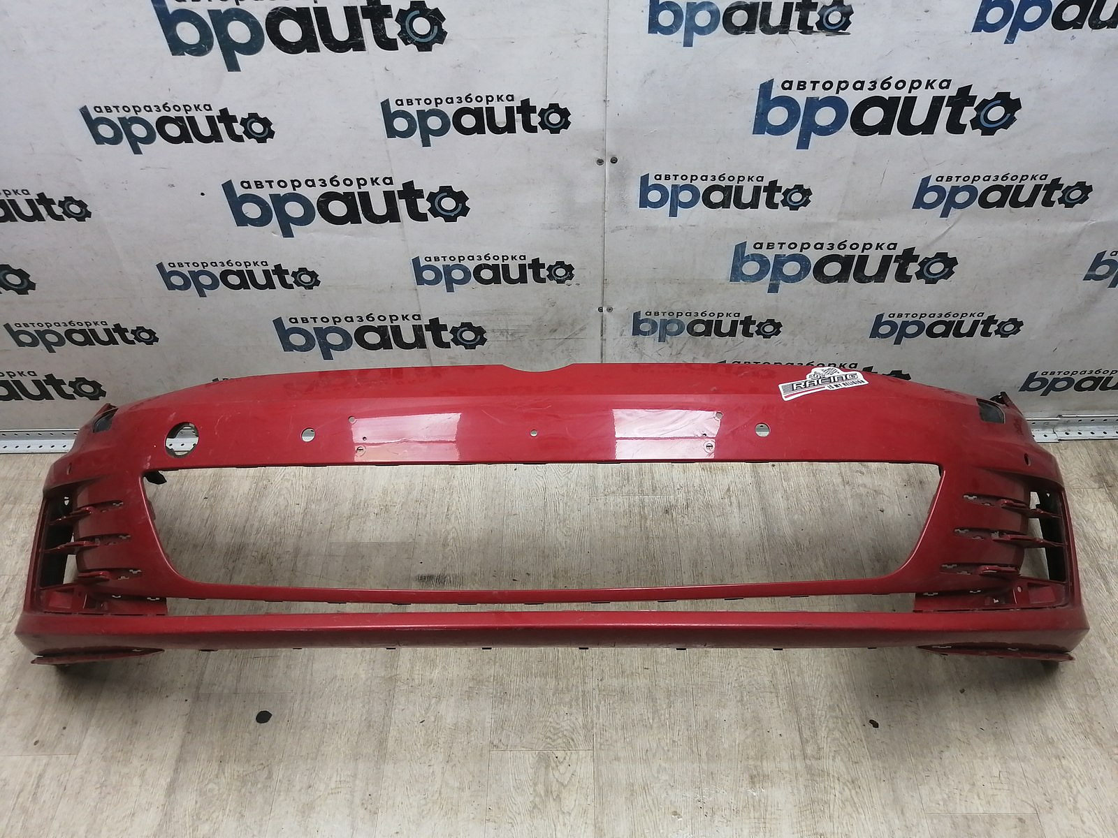 Фотография детали BA000230; Бампер передний, GTI; под паркт.; под омыват. (5G0807221L) для Volkswagen Golf/БУ; Оригинал; Р2, Удовлетворительное; . Фото номер 1