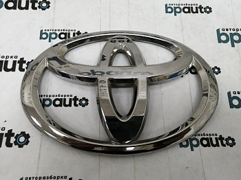 Пример детали Эмблема на крышку багажника (90975-02182); Toyota Alphard II (2010 — 2014), Auris I рест. (2010- 2013), Land Cruiser Prado 150 (2010 — 2013) /AA016158/ БУ; Оригинал; Р0, Хорошее; 