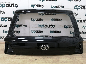 Пример детали Крышка багажника верхняя (67005-60D51); Toyota Land Cruiser 200 рест. (2012 — 2015) /AA011176/ БУ; Оригинал; Р0, Хорошее; (218) Черный перламутр