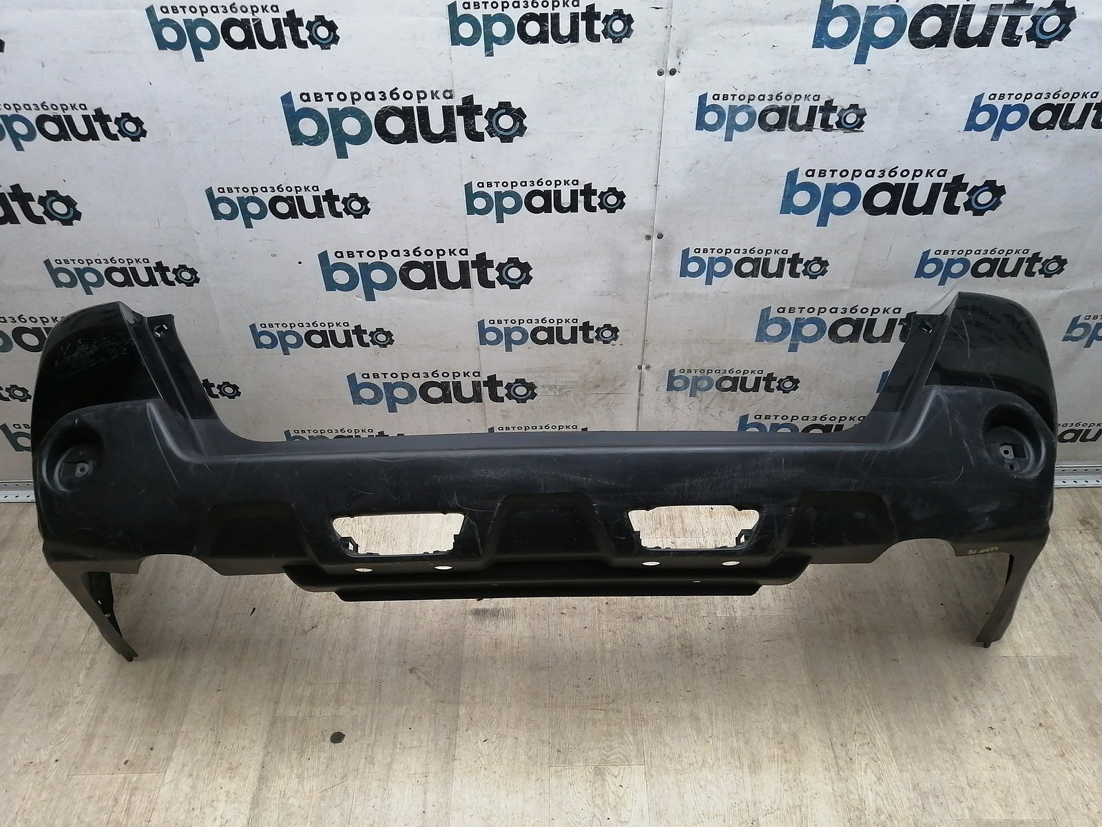Пример детали Бампер задний; без паркт. (85022-JU14H); Nissan X-Trail II (T31) (2007-2011), II (T31) рест. (2011-2015) /BA000198/ БУ; Оригинал; Р1, Мелкий дефект; 