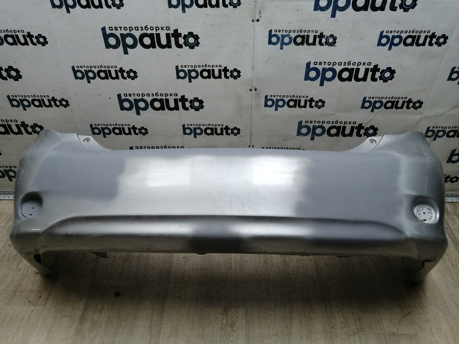 Пример детали Бампер задний; без паркт. (52159-12A30); Toyota Corolla 150 (2006-2009) /AA045245/ БУ; Оригинал; Р2, Удовлетворительное; 