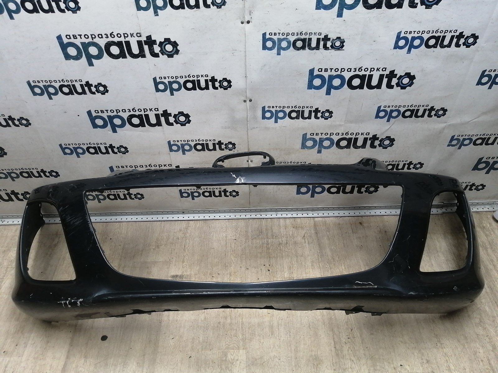 Пример детали Бампер передний; без паркт.; под омыват. (EH44-50031); Mazda CX-7 I рест. (2009-2012) /AA045729/ БУ; Оригинал; Р1, Мелкий дефект; 