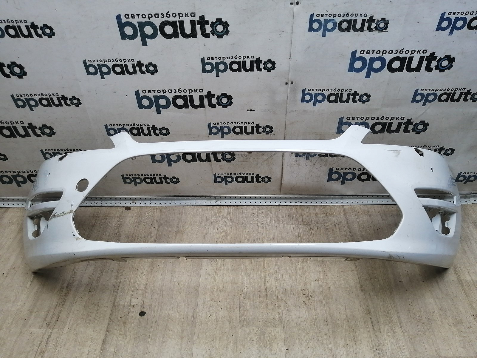 Пример детали Бампер передний; под паркт.; под омыват. (BS71-17757-A); Ford Mondeo Sedan IV рест. (2010- 2014), Wagon IV рест. (2010- 2014), Liftback IV рест. (2010- 2014) /AA046147/ БУ; Оригинал; Р1, Мелкий дефект; ДхШхВ 2х0,58х0,49; 