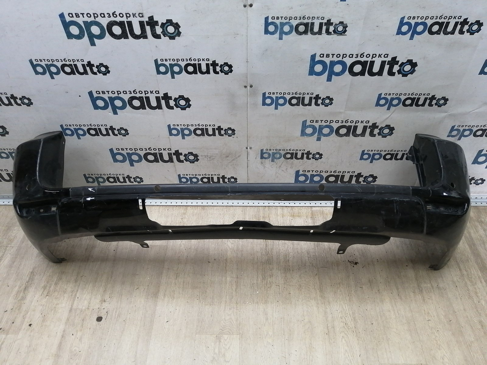 Пример детали Бампер задний, Long; под паркт. (52159-42130); Toyota Rav4 30 рест. V 2.4 (2009 - 2010) /AA044791/ БУ; Оригинал; Р2, Удовлетворительное; 