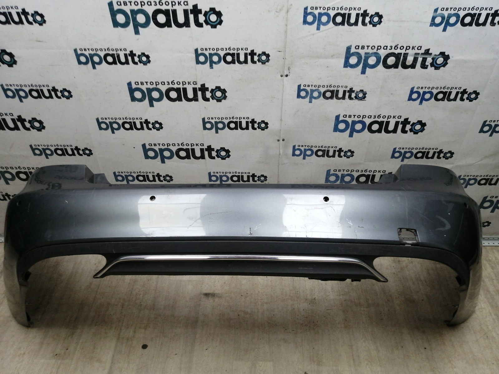 Пример детали Бампер задний; под паркт. (A2128857625); Mercedes-Benz E-klasse IV Sedan рест. (W212) (2013-2016) /AA045468/ БУ; Оригинал; Р1, Мелкий дефект; 