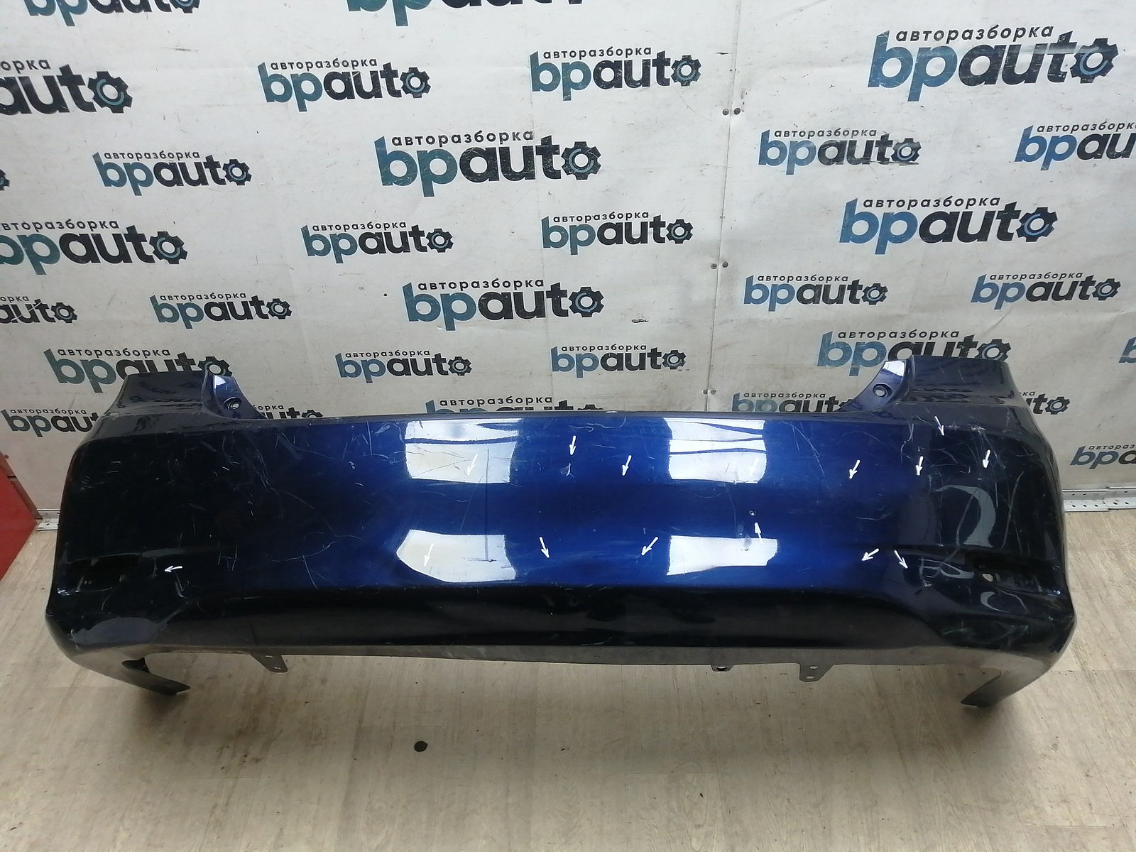 Пример детали Бампер задний; без паркт. (52159-12B30); Toyota Corolla 150 рест. (2010-2013) /AA045921/ БУ; Оригинал; Р2, Удовлетворительное; 