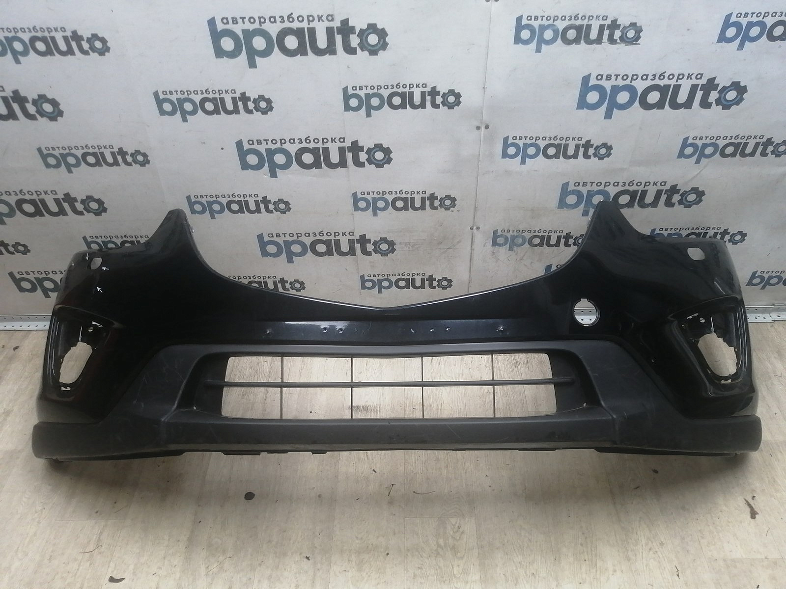 Пример детали Бампер передний; без паркт.; под омыват. (KD45-50031); Mazda CX-5 I (2011-2015), I рест. (2015-2017) /AA045759/ БУ; Оригинал; Р1, Мелкий дефект; 
