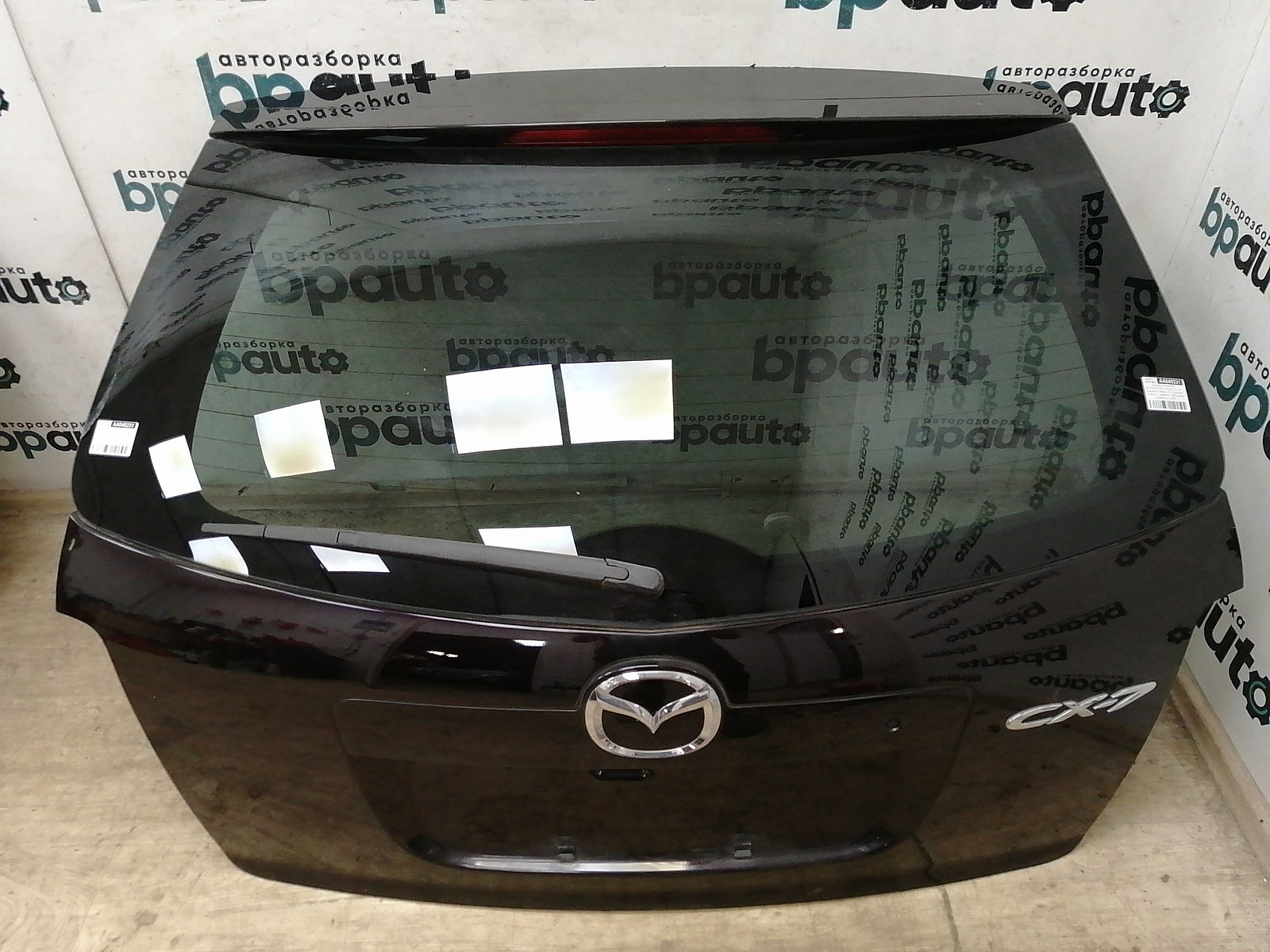 Пример детали Крышка багажника (EGY56202XB); Mazda CX-7 I (2006-2009), I рест. (2009-2012) /AA040231/ БУ; Оригинал; Р0, Хорошее; (28W) Темно-красный перламутр (Бордовый)