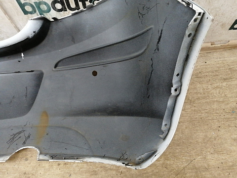 Фотография детали AA034082; Бампер задний, под маленький вырез выхл.трубы; под паркт. (13179916) для Opel Corsa D HB 5D (2006 — 2010)/БУ; Оригинал; Р2, Удовлетворительное; . Фото номер 14