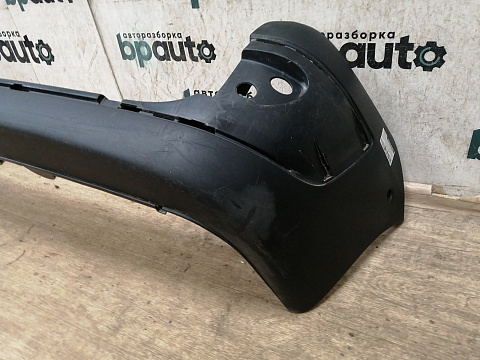 Фотография детали AA034285; Бампер задний; без паркт. (8200150631) для Renault Kangoo I рест. (2003-2008)/БУ; Оригинал; Р1, Мелкий дефект; . Фото номер 2