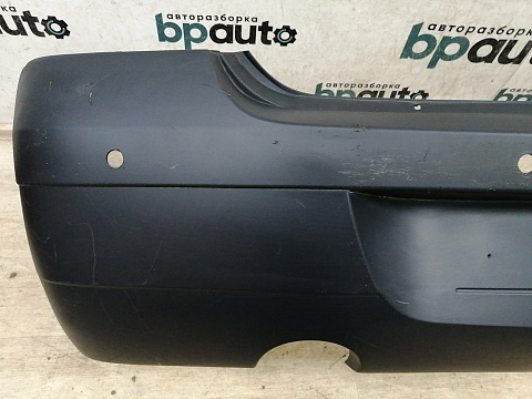 Фотография детали AA033291; Бампер задний; под паркт. (8200576893) для Renault Logan I (2004-2009)/БУ; Оригинал; Р1, Мелкий дефект; . Фото номер 8
