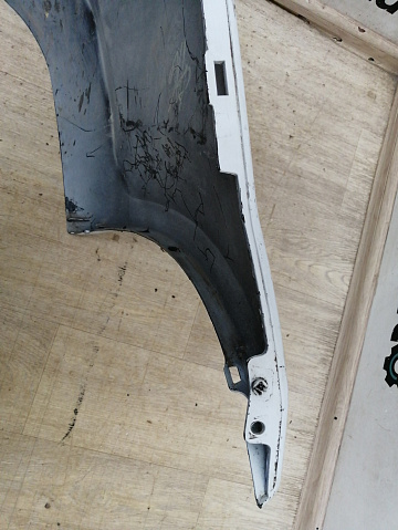 Фотография детали AA042870; Бампер задний; без паркт. (8200916804) для Renault Logan I рест. (2009-2015)/БУ; Оригинал; Р1, Мелкий дефект; . Фото номер 11